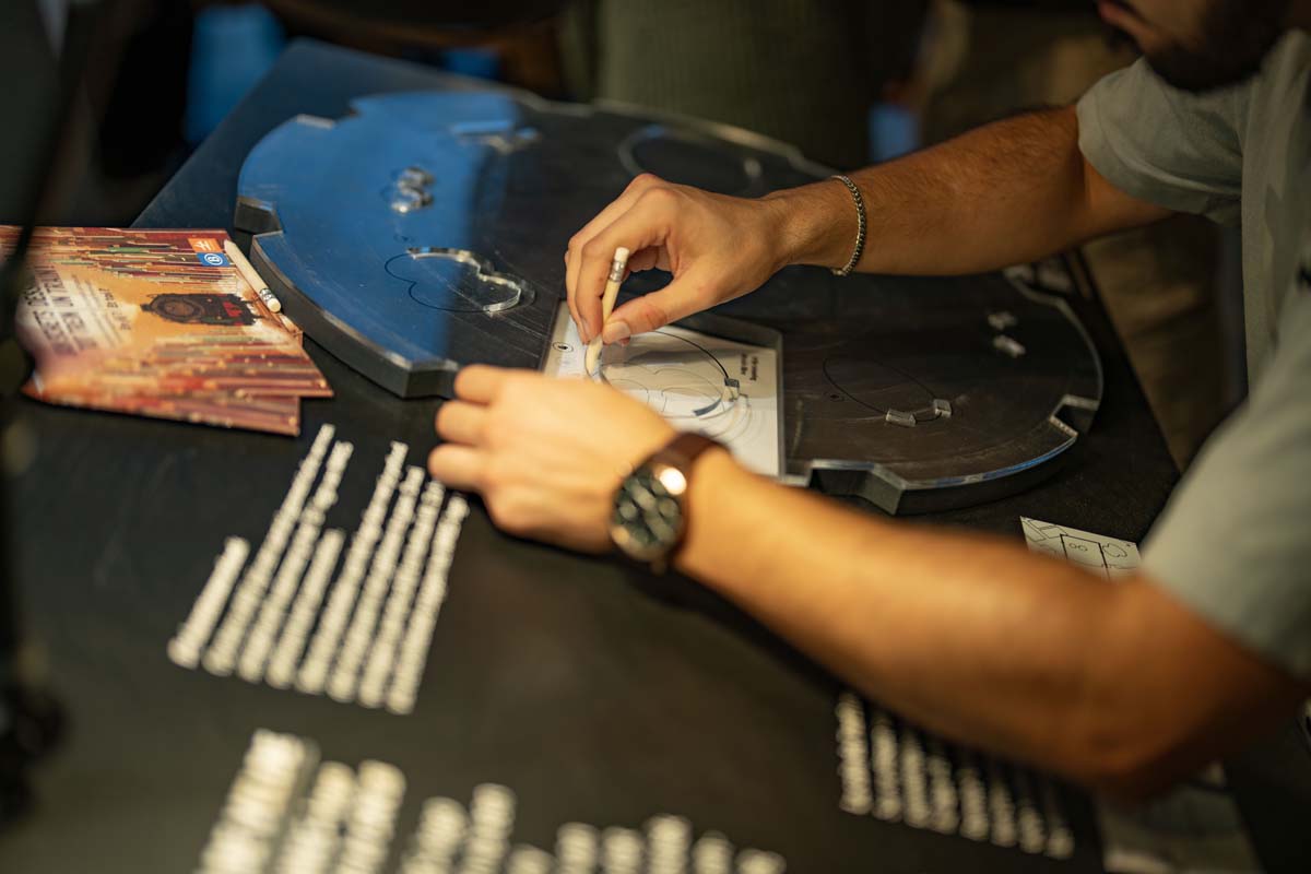 Visitor using an interactive drawing table